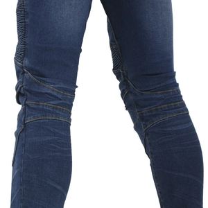 Detail of blue motorcycle jeans featuring accordion panels and yellow double stitching