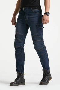 Detail of motorcycle jeans showing accordion stretch panels on knees and side cargo pocket