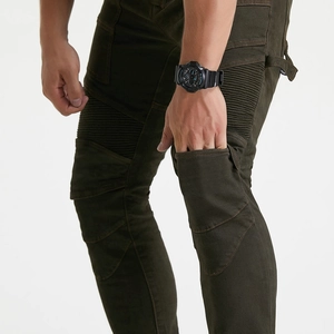 Men's olive green motorcycle cargo pants with stretch accordion panels and protective design
