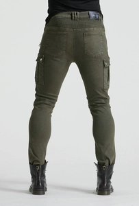 Detail view of olive green motorcycle jeans with flexible accordion panels and leather logo