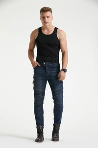 Detail of dark blue motorcycle jeans featuring protective knee pleats and cargo pockets