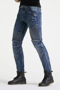 Detail of pleated biker knee panels and zip accents on slim fit vintage blue motorcycle jeans