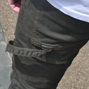 Detail of reinforced side loop and heavy-duty twill fabric on motorcycle riding pants
