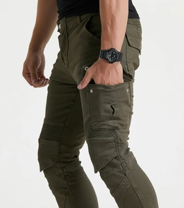 Detail view of olive green motorcycle jeans showing side cargo pockets and knee pleats
