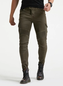 Macro detail of dark olive motorcycle jeans with protective knee pleats and cargo pockets