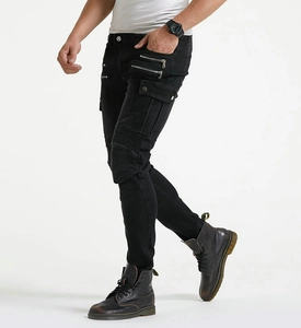 Detail of slim-fit black motorcycle jeans with pleated knee panels and cargo pockets