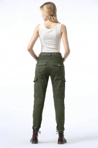 Detail of army green women's motorcycle pants featuring elasticated waist and cargo pockets