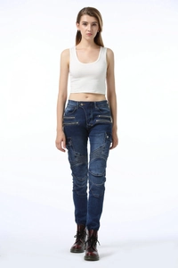 Close-up of articulated pleated knees and metal zipper pockets on women's biker jeans