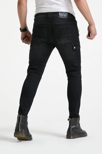 Rear view of black motorcycle jeans with accordion stretch panels and cargo pockets
