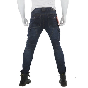 Detail of navy biker jeans featuring accordion stretch panels and cargo flap pockets