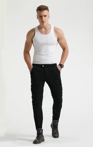 Detail of men's slim black motorcycle jeans with knee pleats and utility cargo pockets
