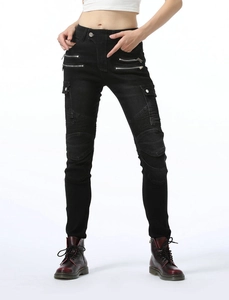Detail of high-waist biker jeans featuring thigh zippers and pleated knee protection pads