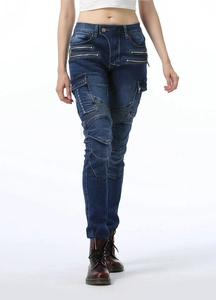 Detail of blue biker jeans for women showing knee stretch panels and metal zippers