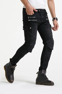 Detail of black motorcycle riding jeans featuring protective ribbed panels and side cargo pockets