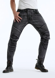 Close-up of pleated knee panel on dark grey motorcycle biker jeans with wash effect