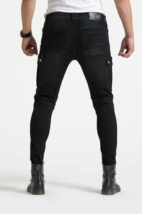 Detail view of motorcycle jeans with protective pads and back logo patch for riders