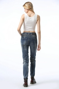 Women's blue moto denim pants featuring accordion stretch panels on the back waist and knees