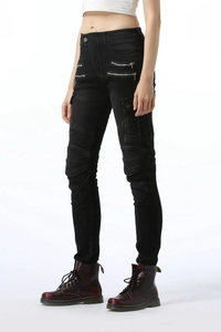Close-up of women's black biker jeans with ribbed knee panels and side cargo pockets