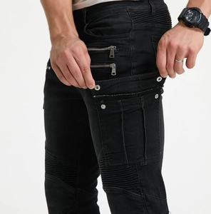 Detail of motorcycle jeans showing side cargo pockets, dual zippers and pleated knees