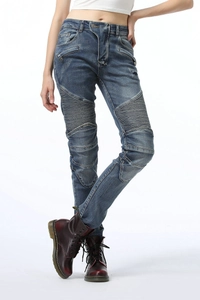 Detail of high-waist biker jeans featuring pleated stretch panels and zipper pockets