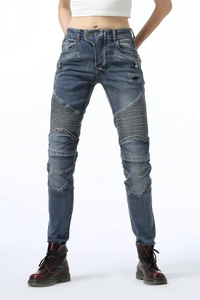 Detail view of motorcycle jeans with ribbed knee panels and dark blue washed denim texture