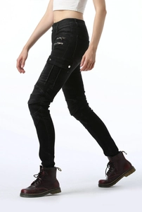 Detail of slim-fit biker jeans for women with cargo pockets and pleated knee panels