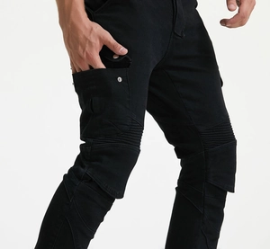 Detail of black motorcycle cargo pants featuring side flap pockets and knee pleats
