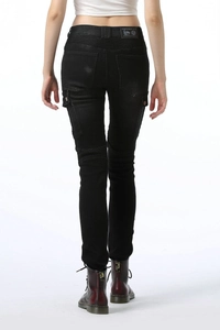 Detail view of women's black biker jeans with stretch panels and side cargo pockets