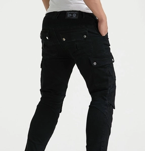 Detail of black motorcycle riding jeans showing accordion stretch panels on waist and knees