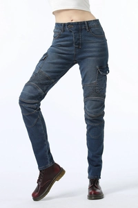Detail of blue motorcycle jeans with ribbed accordion panels and cargo pockets for women