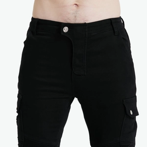 Close-up of black motorcycle jeans featuring cargo pockets and knee protective stitching