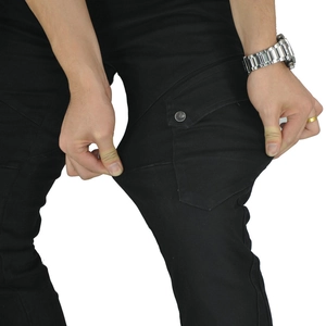 Detail shot of black slim-fit motorcycle pants showing high elasticity and side cargo pockets
