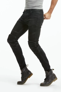 Dettaglio dei jeans biker slim da uomo con pannelli a costine e denim nero lavato