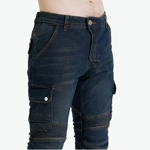Detail of blue motorcycle cargo jeans with accordion pleats and utility side pockets