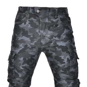 Detail of cargo motorcycle pants featuring camo pattern and pleated reinforcement sections