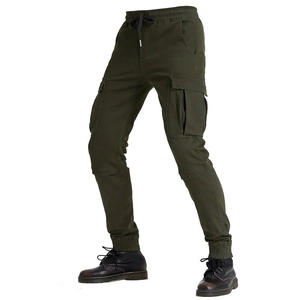 Detail of army green cargo pants featuring large side pockets and drawstring waist