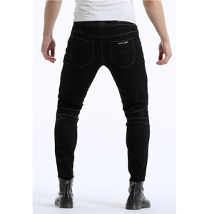 Detail of black motorcycle jeans featuring Moto-jeans print and accordion stretch panels