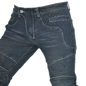 Detail of motorcycle jeans featuring accordion panels and diamond quilted side pockets