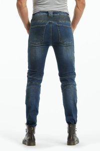 Dettaglio dei jeans moto blu vintage con pannelli elasticizzati a soffietto in vita