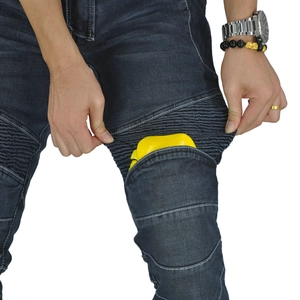 Detail of stretch panels and knee protector pocket on blue motorcycle riding jeans