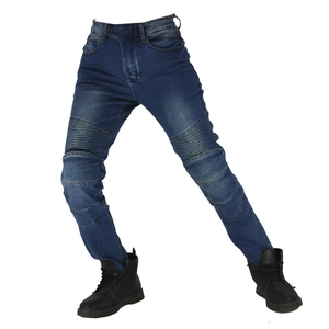 Detail of moto pleats on knees of dark blue stretch denim motorcycle riding pants
