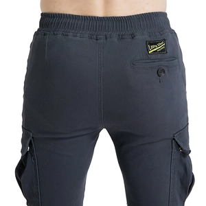 Detail of cargo motorcycle pants featuring back flap pockets and elastic drawstring waist