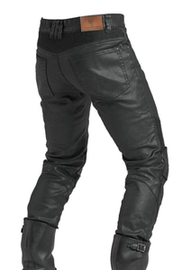 Detail view of motorcycle jeans featuring rear accordion stretch panels and leather logo patch