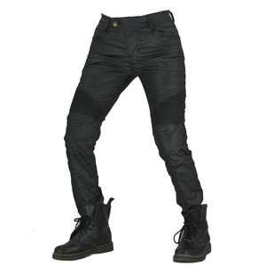 Women's coated waterproof motorcycle jeans with accordion panels and black leather boots