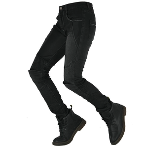 Detail view of flexible accordion stretch panels on black slim-fit biker jeans for women