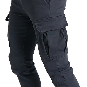 Detail view of motorcycle cargo pants featuring a durable large side flap pocket design