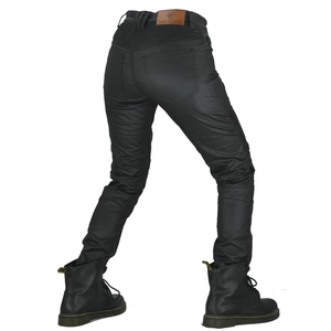 Detail of rear stretch panels and leather brand label on black waterproof motorcycle jeans