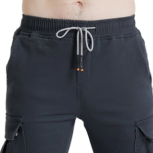Close-up of cargo pants elastic waist with adjustable drawstring and fabric texture