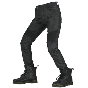 Women's coated waterproof motorcycle jeans with accordion panels and black biker boots