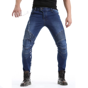 Waterproof motorcycle jeans showing water droplets rolling off the protective fabric
